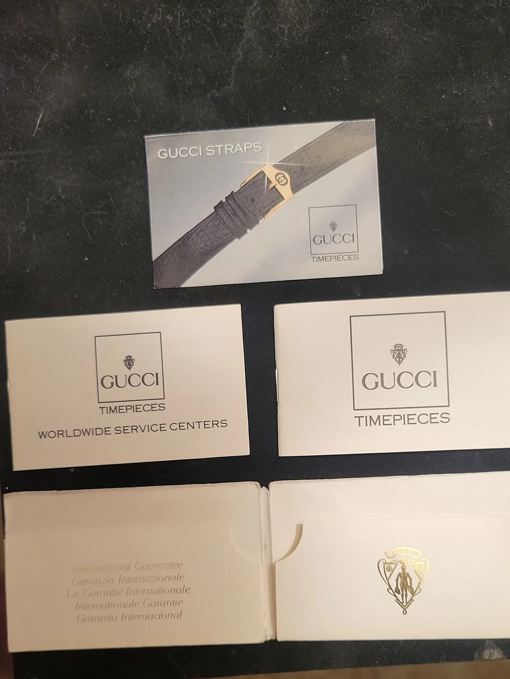 Gucci Gold-Tone Watch with Green Dial and Black Leather Strap